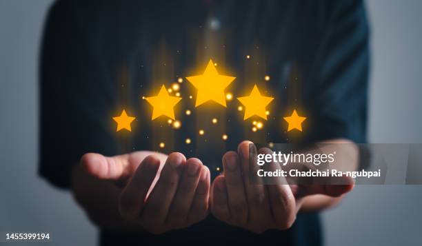 customer giving a five star rating.men giving positive review for client's satisfaction surveys. evaluation feedback.  service rating, satisfaction concept. - great customer service stock pictures, royalty-free photos & images