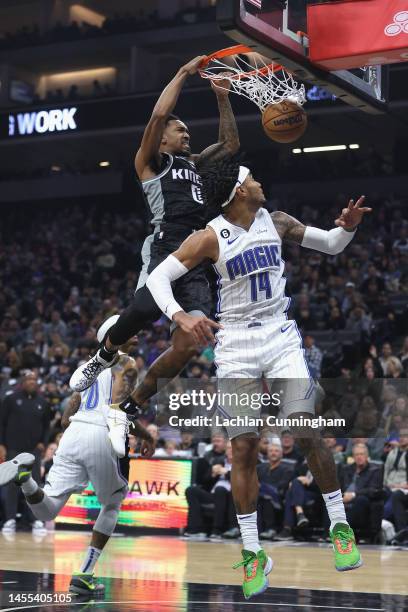 Malik Monk of the Sacramento Kings dunks the ball against Gary Harris of the Orlando Magic in the first quarter at Golden 1 Center on January 09,...