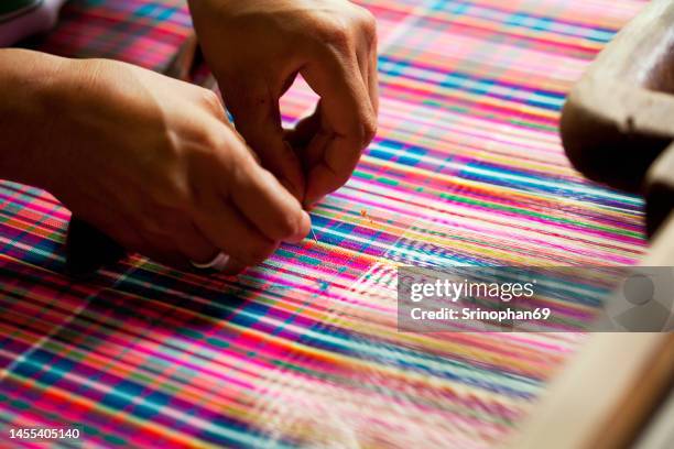 colorful silk threads on the loom - tissage photos et images de collection
