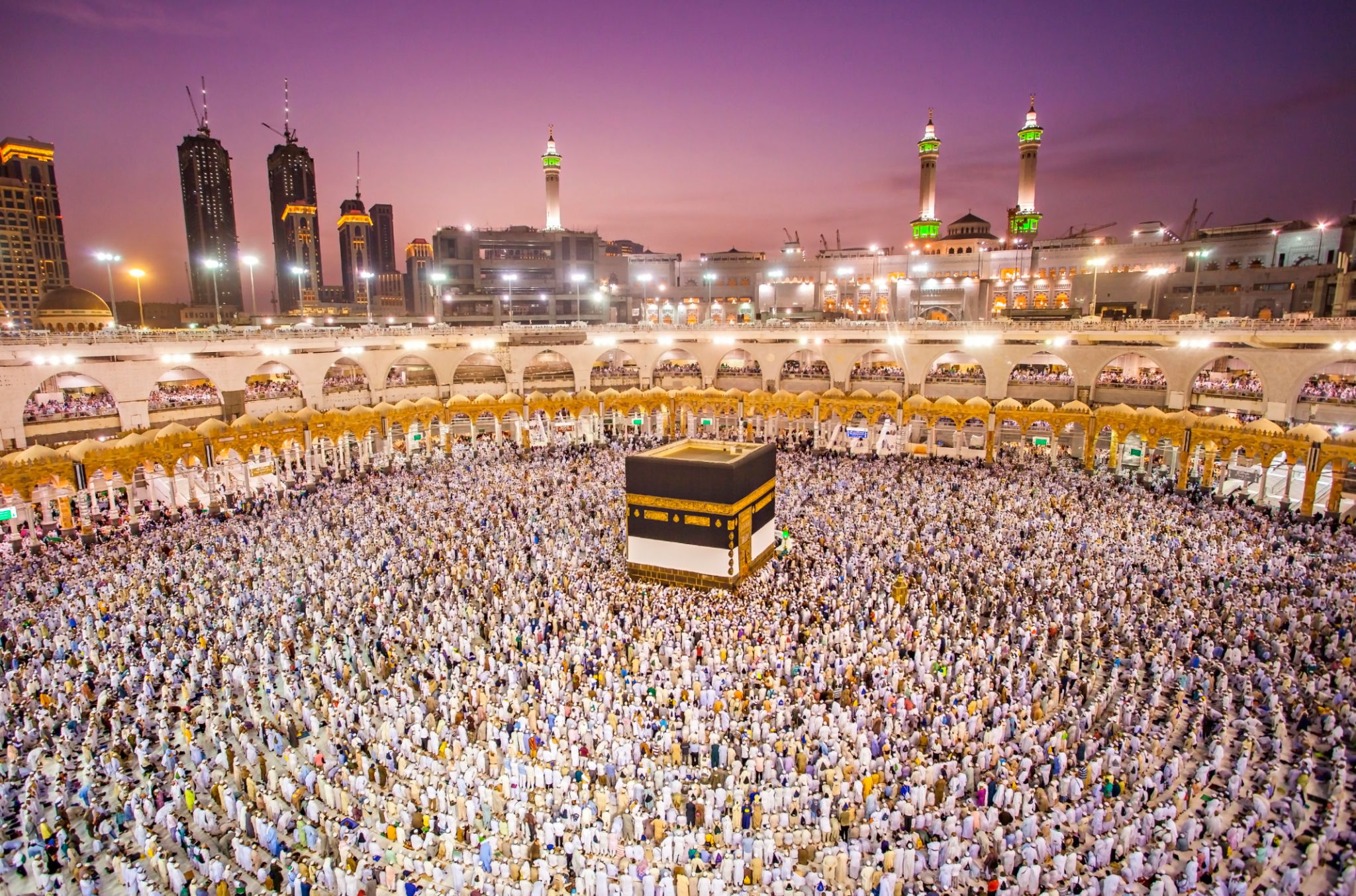 Muslim pilgrims from all around the world doing tawaf, praying around the kabah in Mecca, Saudi Arabia Muslim pilgrims from all around the world doing tawaf, praying around the kabah in Mecca, Saudi Arabia