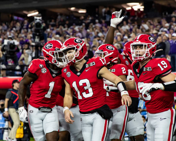 Stetson Bennett of the Georgia Bulldogs celebrates his touchdown with his teammates during a game between Texas Christian Horned Frogs and Georgia...