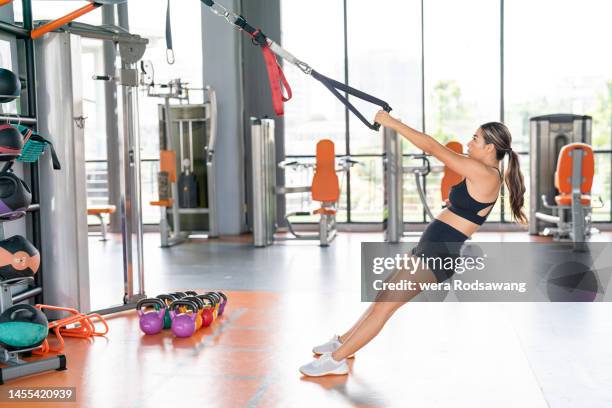 suspension training rope exercise at gym - suspension training stock pictures, royalty-free photos & images
