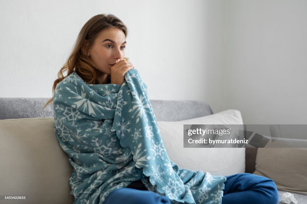 Woman freezing at home