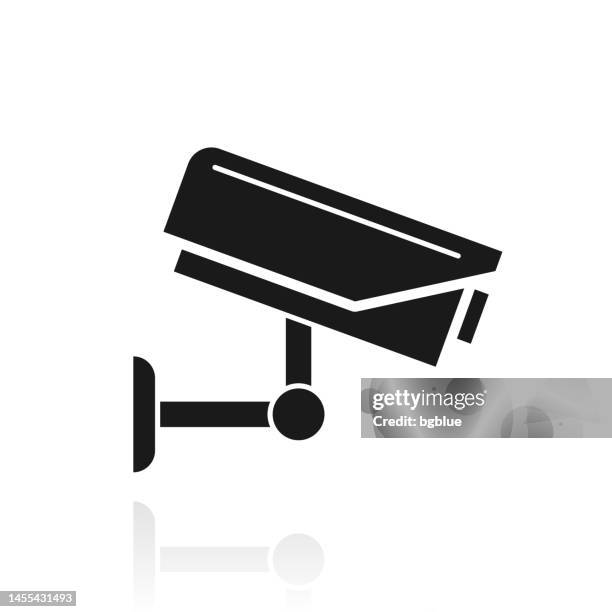 cctv - security camera. icon with reflection on white background - security camera white background stock illustrations