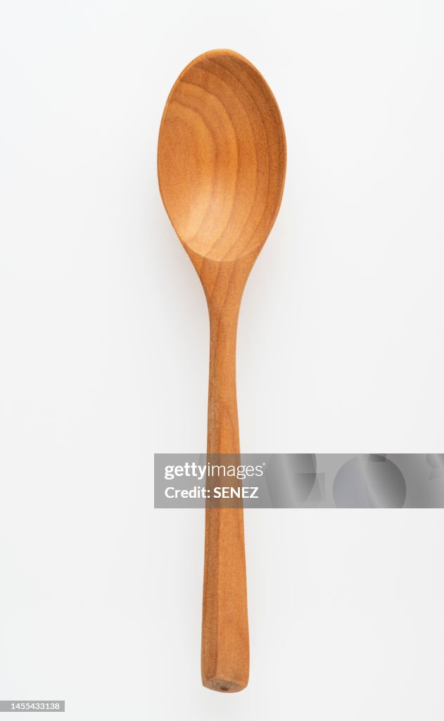 Directly Above View Of Wooden Spoon Against White Background