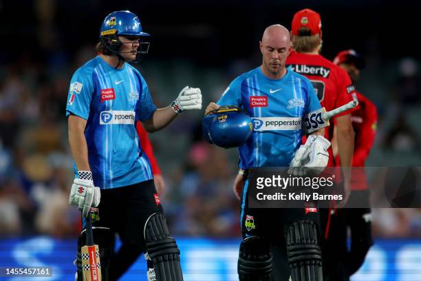 Thomas Kelly of the Strikers and Chris Lynn of the Strikers fist bump at the end of the innings during the Men's Big Bash League match between the...