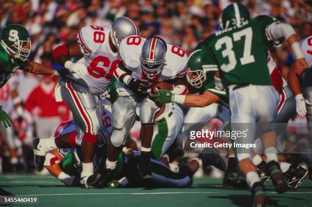 Jeff Cothran, Running Back for the Ohio State Buckeyes running the football out of the pocket through the Spartans defense during the NCAA Big Ten...