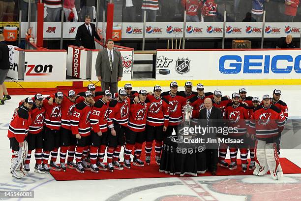 The New Jersey Devils are presented with the Prince of Wales Trophy by NHL Deputy Commissioner Bill Daly after winning in Game Six of the Eastern...