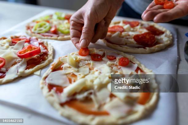 making a homemade pizza - tomato paste stock pictures, royalty-free photos & images