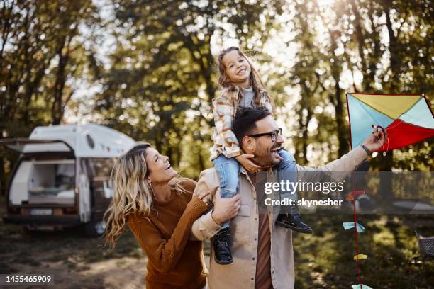 fun with a kite at trailer park! - campervan stock pictures, royalty-free photos & images