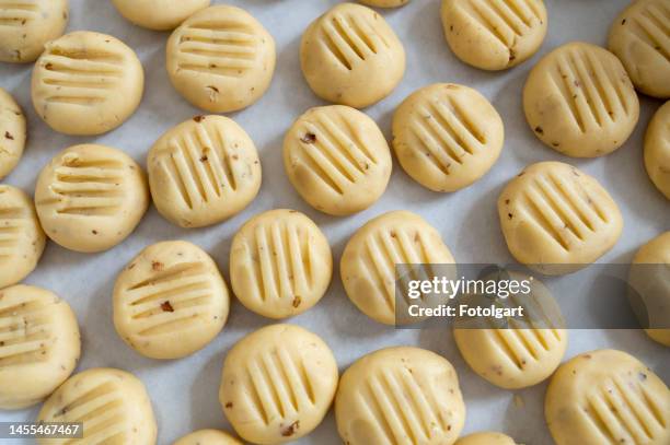 cookie doughs lined up on a tray - dough stock pictures, royalty-free photos & images