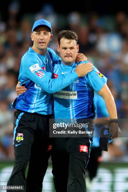 Matt Short and Ben Manenti of the Strikers celebrate the wicket of Sam Harper of the Renegades during the Men's Big Bash League match between the...