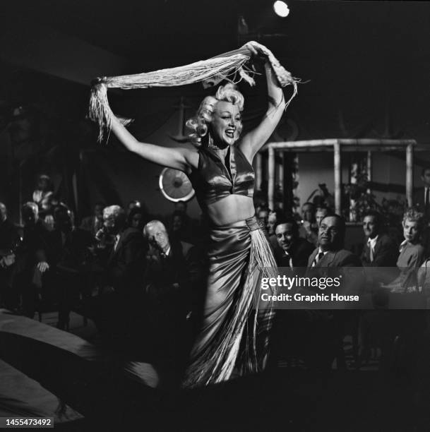 American actress Jan Sterling filming 'The Human Jungle', in Los Angeles, California, 1954. Sterling plays burlesque dancer Mary Abbott in the crime...