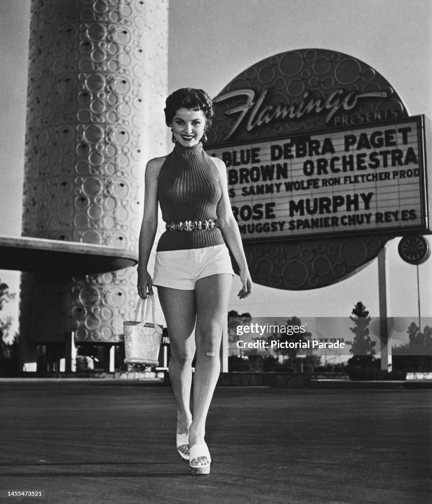 Debra American actress Debra Paget wearing knitted sleeveless, turtleneck ...