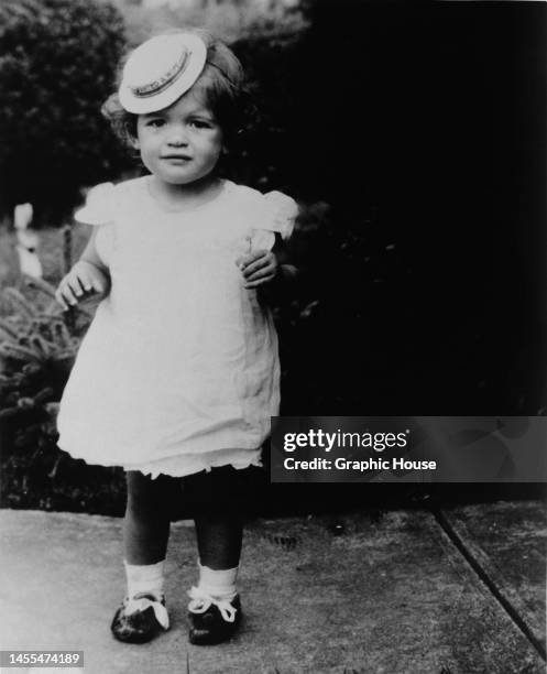 American actress, singer and glamour model Jayne Mansfield pictured as a 16-month-old girl, wearing a hat at an angle, United States, October 1934.