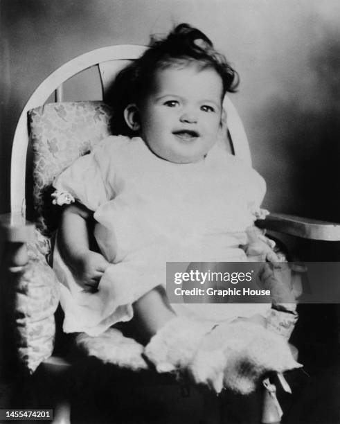 American actress, singer and glamour model Jayne Mansfield pictured as a three-month-old girl, sitting in a high chair at Laubach's department store...