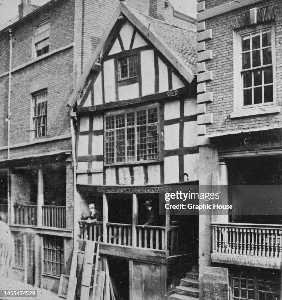 God's Providence House, a sandstone and timber framed building, with a fascia board inscribed 'God's Providence is Mine Inheritance', on Watergate...