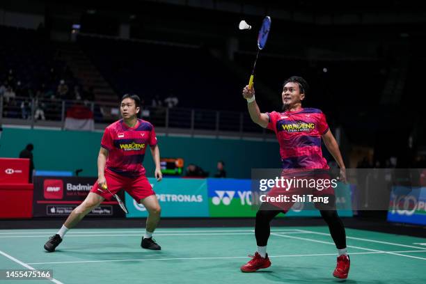 Mohammad Ahsan and Hendra Setiawan of Indonesia compete in the Men's Doubles First Round match against Zhou Haodong and He Jiting of China on day one...