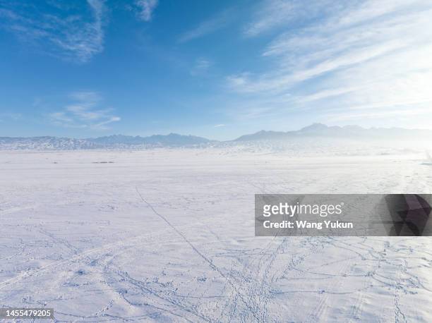 background image of snowfield and sky - snowfield stock pictures, royalty-free photos & images