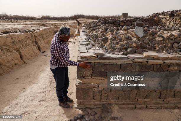Eritrean archeologists Dr. Abraham Zerai discusses structural details of what has been identified as a Paleochristian church built between the first...