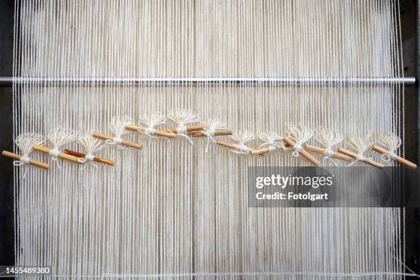 wool threads prepared and lined up on a weaving loom - loom stock pictures, royalty-free photos & images