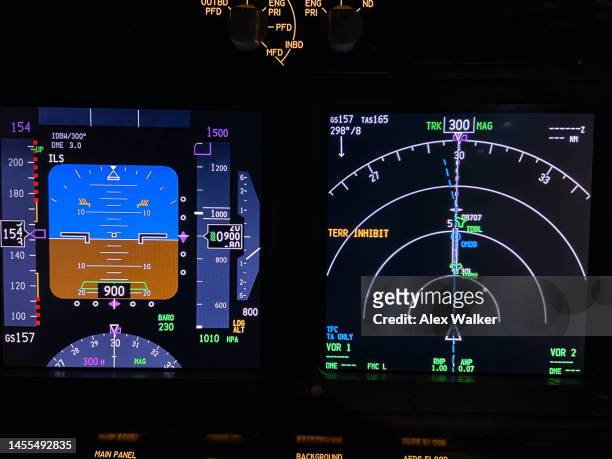 instrument screens in cockpit, flight deck, of a commercial aircraft. - civil aviation stock pictures, royalty-free photos & images