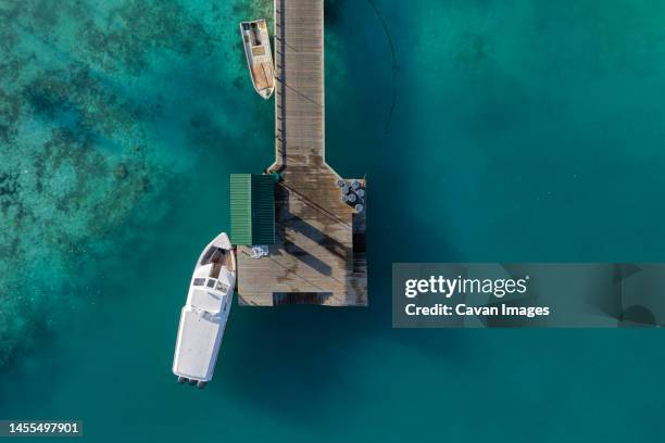 aerial view of boats and pier - thulusdhoo stock pictures, royalty-free photos & images