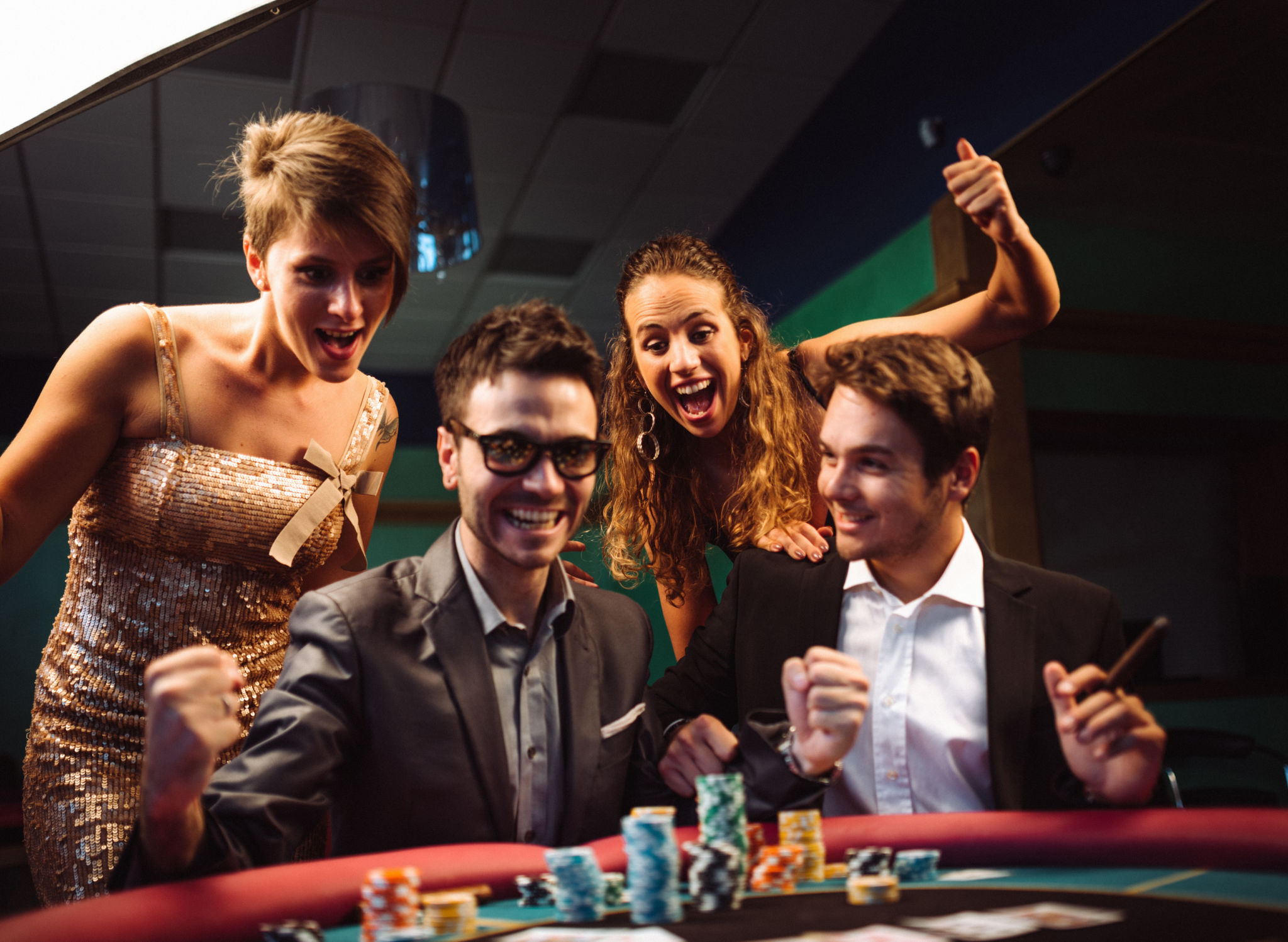 happiness friends winning at the casino playing poker happiness friends winning at the casino playing poker