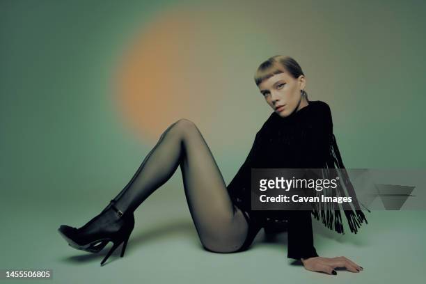 model with a bang wearing black tights - dark clothes stock pictures, royalty-free photos & images