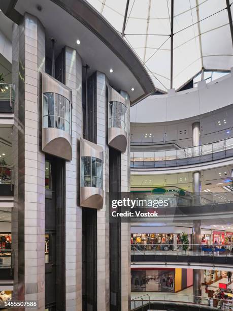 shopping mall interior - lift roof stock-fotos und bilder