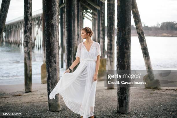 vintage bride posing on beach in laced wedding dress in muir woo - coast redwood stock pictures, royalty-free photos & images