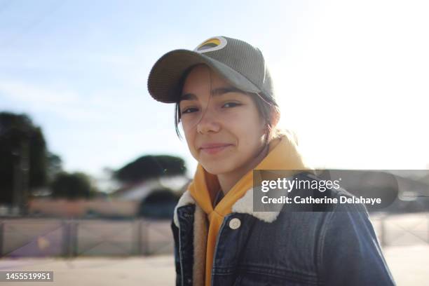 a 13 year old girl posing in front of her school - route 13 stock pictures, royalty-free photos & images