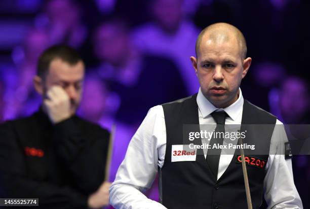 Barry Hawkins of England looks down the table during their first round match against Mark Allen of Northern Ireland at Alexandra Palace on January...