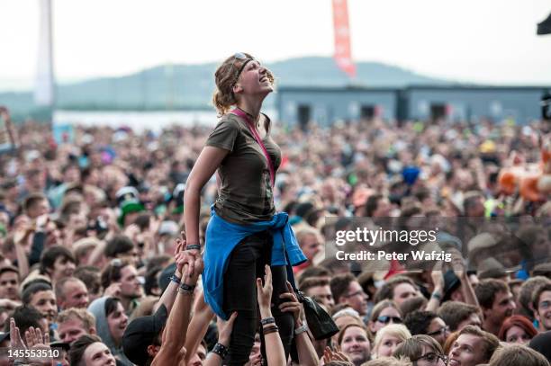 Spectators celebrate during the first day of Rock Am Ring on June 01, 2012 in Nuerburg, Germany.