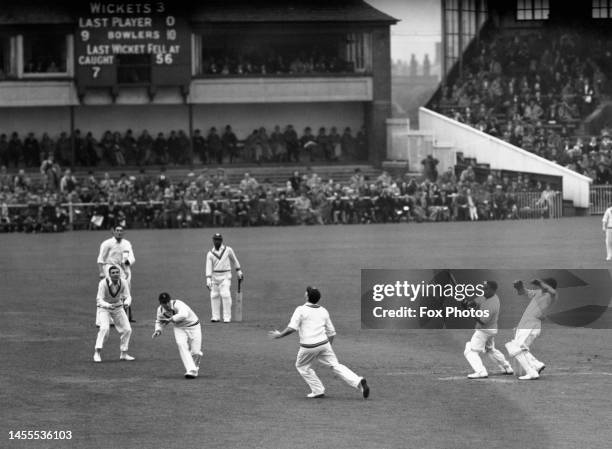 Derek Sealy from Barbados and the touring the West Indies cricket team plays a shot over the England fielders at mid wicket during the West Indies...