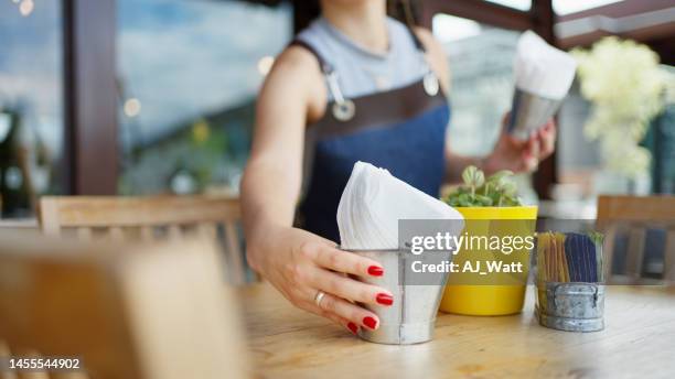 server setting a patio table outside of an organic cafe - serveur restaurant stock pictures, royalty-free photos & images