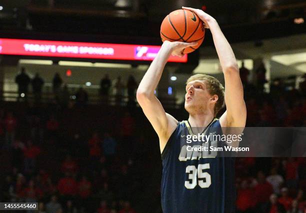 Connor Vanover of the Oral Roberts Golden Eagles shoots a 3-pointer against the New Mexico Lobos during the first half of their game at The Pit on...