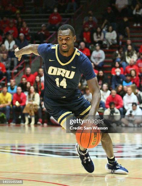 DeShang Weaver of the Oral Roberts Golden Eagles drives to the basket against the New Mexico Lobos during the first half of their game at The Pit on...
