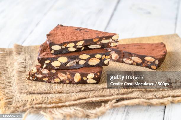 close-up of chocolate chip on table,romania - chocolate bar stock pictures, royalty-free photos & images