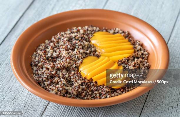 quinoa with slices of peach close up,romania - black seed oil - fotografias e filmes do acervo