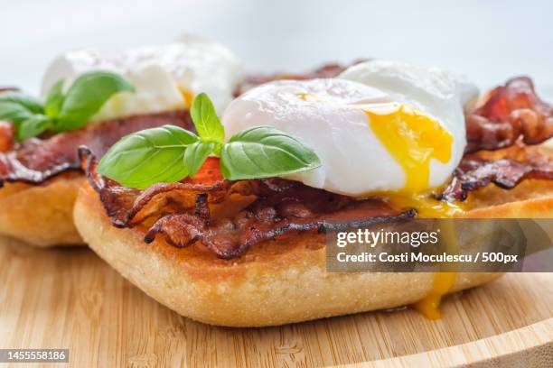 sandwich with poached egg and bacon,romania - bacon strip stock pictures, royalty-free photos & images