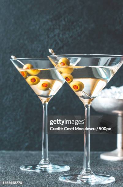 close-up of drink in glasses on table,romania - martini stockfoto's en -beelden