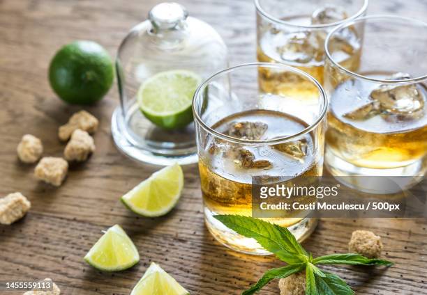 glass of rum on the wooden background,romania - tequila foto e immagini stock