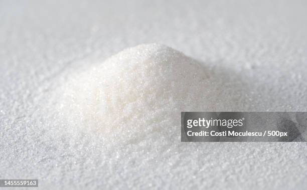 close-up of sugar cubes on table,romania - carbohydrate photos et images de collection