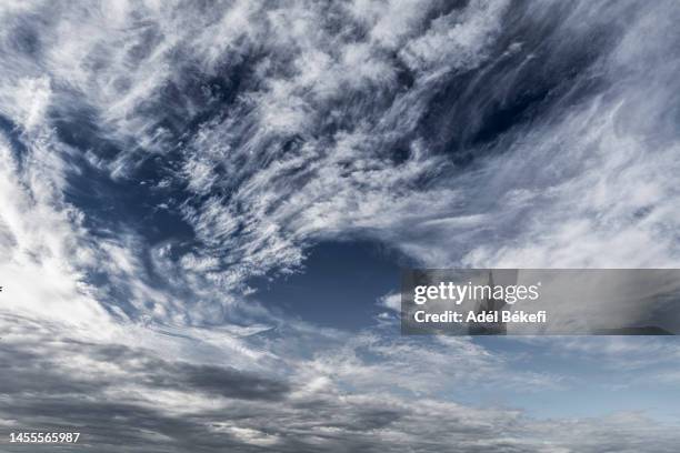 big cirrocumulus cloud in the blue sky - altocumulus stock pictures, royalty-free photos & images