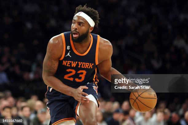 Mitchell Robinson of the New York Knicks dribbles during the first half against the Milwaukee Bucks at Madison Square Garden on January 09, 2023 in...