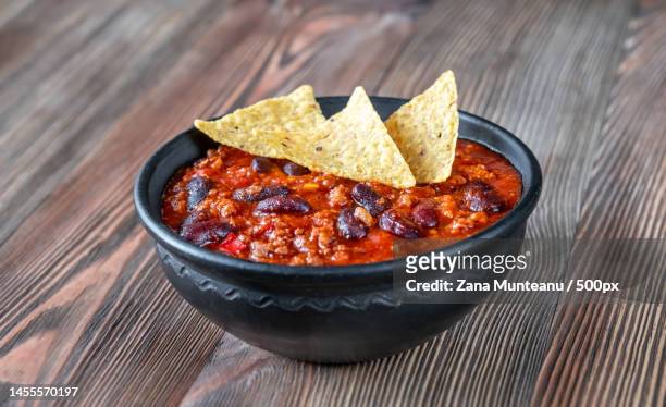 close-up of food in bowl on table,romania - bowl of chili stock-fotos und bilder