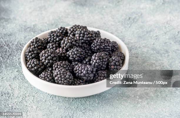close-up of blackberries in bowl on table,romania - blackberries stock pictures, royalty-free photos & images