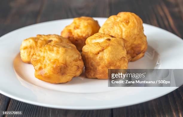 close-up of fried food in plate on table,romania - 天ぷら ストックフォトと画像
