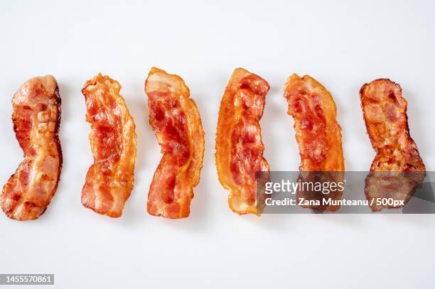 close-up of sausages against white background,romania - bacon strip stock pictures, royalty-free photos & images